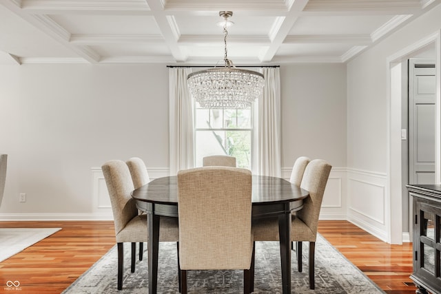 35 E 58th St, Indianapolis, IN 46220 - dining room with a chandelier, light wood-style flooring, beamed ceiling, coffered ceiling, and crown molding