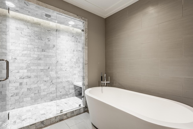 35 E 58th St, Indianapolis, IN 46220 - full bath featuring a freestanding bath, a stall shower, and tile patterned flooring