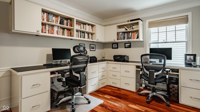 35 E 58th St, Indianapolis, IN 46220 - home office with built in desk, ornamental molding, and dark wood-type flooring