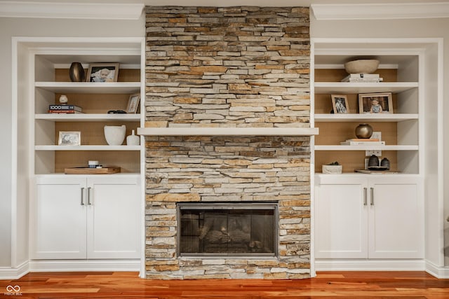 35 E 58th St, Indianapolis, IN 46220 - detailed view of ornamental molding, wood finished floors, a fireplace, and built in features
