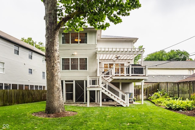 35 E 58th St, Indianapolis, IN 46220 - back of house featuring stairway, a pergola, a wooden deck, a fenced backyard, and board and batten siding