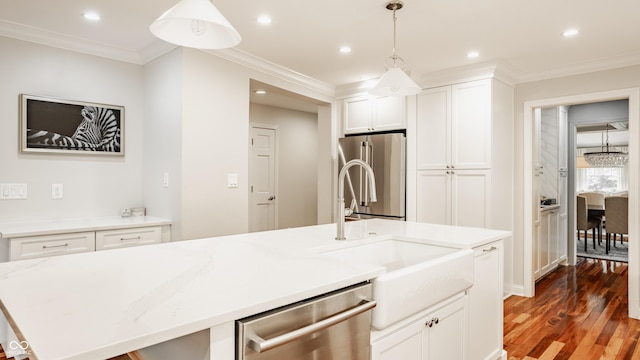 35 E 58th St, Indianapolis, IN 46220 - kitchen with stainless steel appliances, wood finished floors, white cabinets, recessed lighting, and decorative light fixtures
