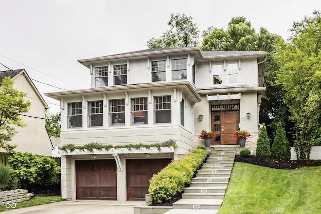 35 E 58th St, Indianapolis, IN 46220 - traditional style home with concrete driveway, stairway, a garage, and a front lawn