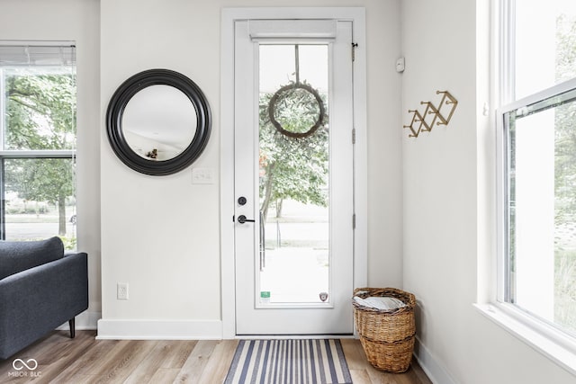 2539 Broadway St, Indianapolis, IN 46205 - doorway to outside featuring wood finished floors and baseboards