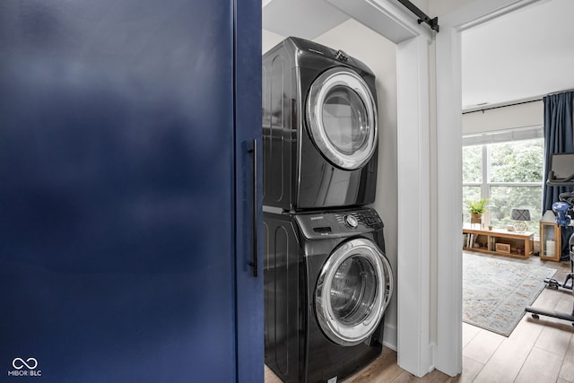 2539 Broadway St, Indianapolis, IN 46205 - laundry room with stacked washer / drying machine and wood finished floors