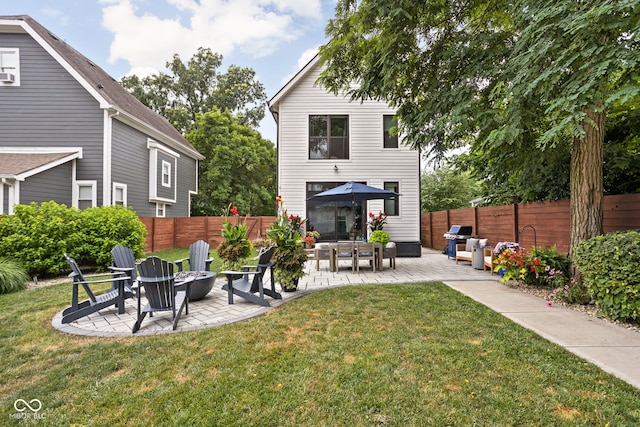 2539 Broadway St, Indianapolis, IN 46205 - rear view of property with a patio, an outdoor fire pit, and a fenced backyard