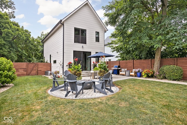 2539 Broadway St, Indianapolis, IN 46205 - rear view of property featuring a patio, a fenced backyard, and a fire pit