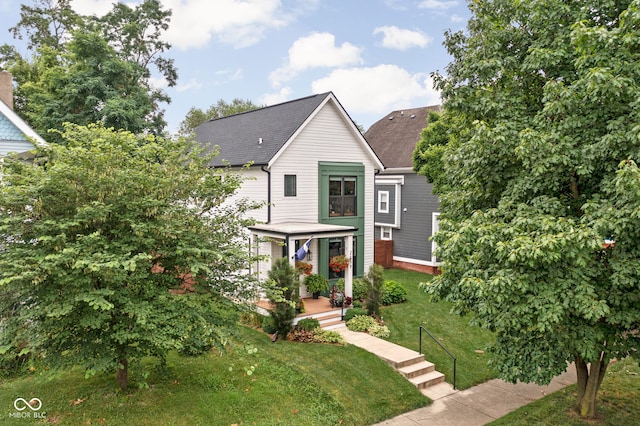 2539 Broadway St, Indianapolis, IN 46205 - view of front of home featuring a front yard and roof with shingles