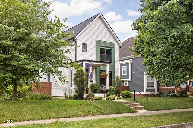 2539 Broadway St, Indianapolis, IN 46205 - view of front facade with a front yard and roof with shingles