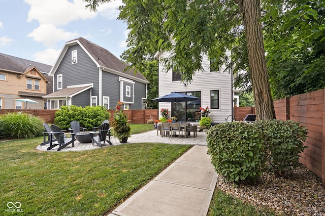 2539 Broadway St, Indianapolis, IN 46205 - back of property with a fire pit, a patio, and a fenced backyard