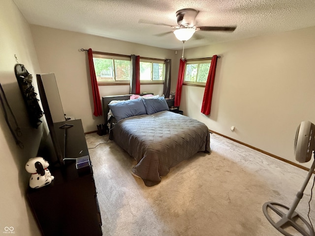 910 Ranch Rd, Connersville, IN 47331 - bedroom with multiple windows, a textured ceiling, carpet, and a ceiling fan