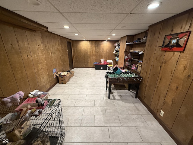 910 Ranch Rd, Connersville, IN 47331 - playroom with wood walls, recessed lighting, a paneled ceiling, and light tile patterned floors