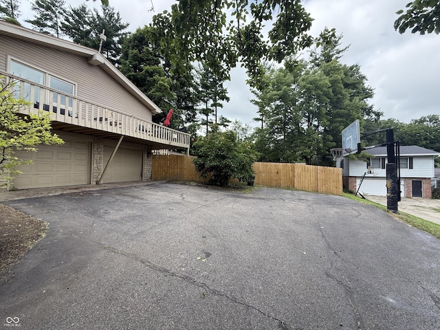 910 Ranch Rd, Connersville, IN 47331 - view of side of property with asphalt driveway and a garage