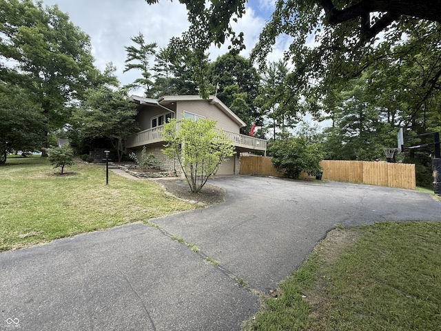 910 Ranch Rd, Connersville, IN 47331 - view of property exterior with driveway, a garage, and a balcony