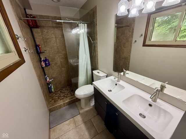 910 Ranch Rd, Connersville, IN 47331 - full bath with a tile shower, double vanity, a textured ceiling, and tile patterned floors