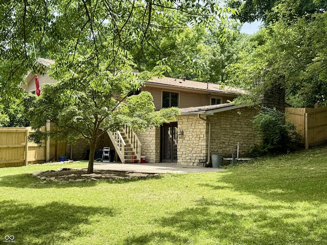 910 Ranch Rd, Connersville, IN 47331 - rear view of property with stone siding, a patio, and stairway