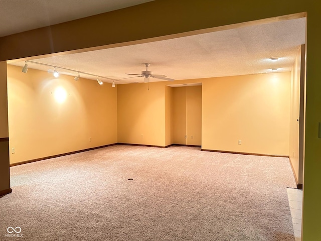 5720 Bayside Dr, Fort Wayne, IN 46815 - spare room featuring light carpet, ceiling fan, track lighting, and a textured ceiling