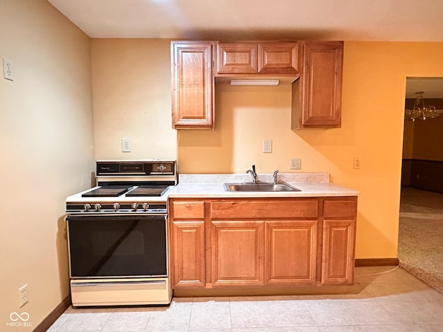 5720 Bayside Dr, Fort Wayne, IN 46815 - kitchen with white electric range oven, light countertops, light tile patterned floors, and brown cabinets
