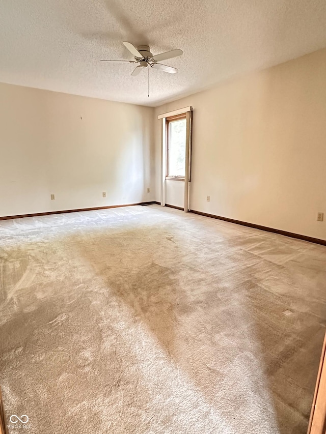 5720 Bayside Dr, Fort Wayne, IN 46815 - spare room with ceiling fan, light colored carpet, and a textured ceiling