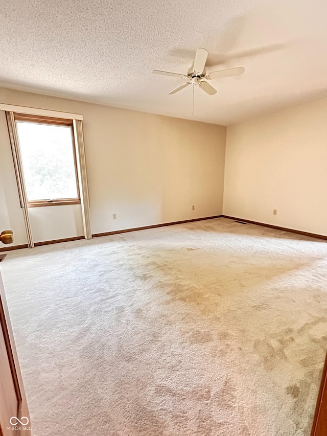 5720 Bayside Dr, Fort Wayne, IN 46815 - unfurnished room featuring light carpet, ceiling fan, and a textured ceiling