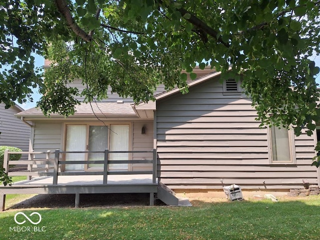 5720 Bayside Dr, Fort Wayne, IN 46815 - back of house featuring a wooden deck and a lawn