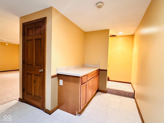 5720 Bayside Dr, Fort Wayne, IN 46815 - hallway with light colored carpet and light tile patterned floors