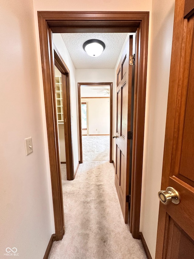 5720 Bayside Dr, Fort Wayne, IN 46815 - hallway with light carpet and a textured ceiling