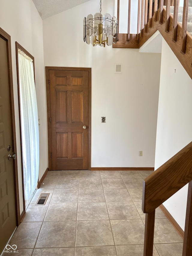 5720 Bayside Dr, Fort Wayne, IN 46815 - foyer entrance featuring a chandelier and light tile patterned flooring