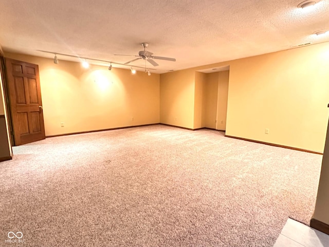 5720 Bayside Dr, Fort Wayne, IN 46815 - empty room featuring carpet, a ceiling fan, a textured ceiling, and track lighting