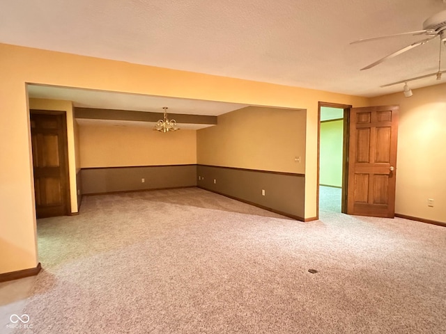 5720 Bayside Dr, Fort Wayne, IN 46815 - carpeted empty room featuring ceiling fan and a chandelier