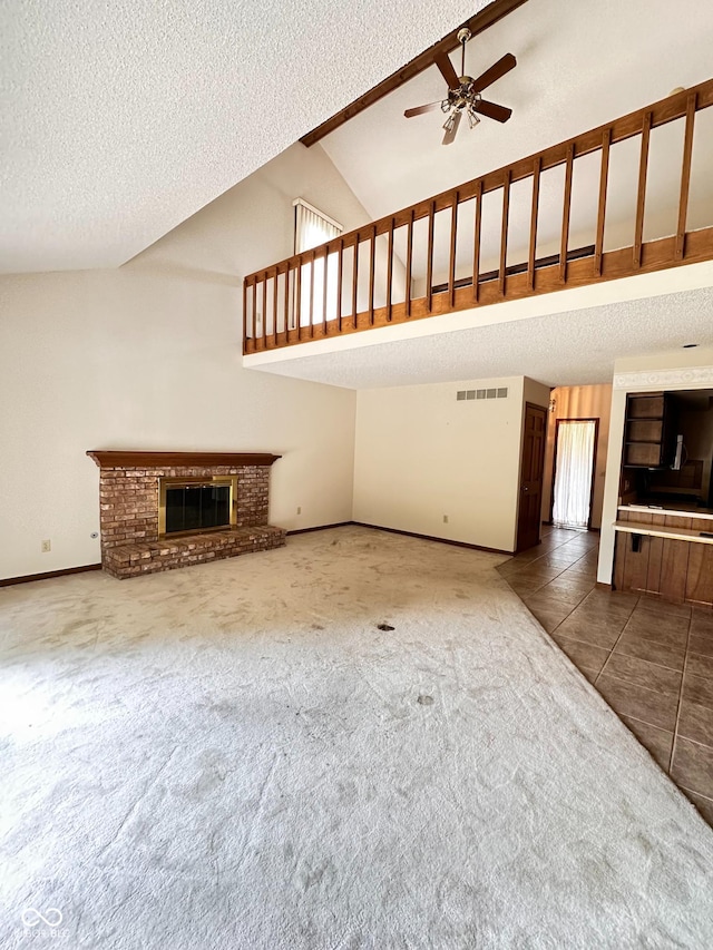 5720 Bayside Dr, Fort Wayne, IN 46815 - unfurnished living room featuring carpet flooring, a textured ceiling, a brick fireplace, ceiling fan, and high vaulted ceiling