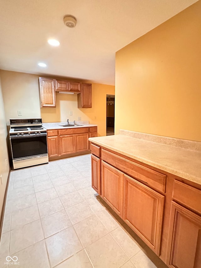 5720 Bayside Dr, Fort Wayne, IN 46815 - kitchen with white gas range oven, light countertops, recessed lighting, light tile patterned flooring, and brown cabinets