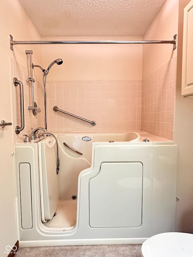 5720 Bayside Dr, Fort Wayne, IN 46815 - bathroom with a textured ceiling, a tub to relax in, and a shower