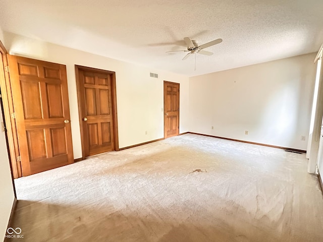 5720 Bayside Dr, Fort Wayne, IN 46815 - unfurnished bedroom with light colored carpet, a textured ceiling, and ceiling fan