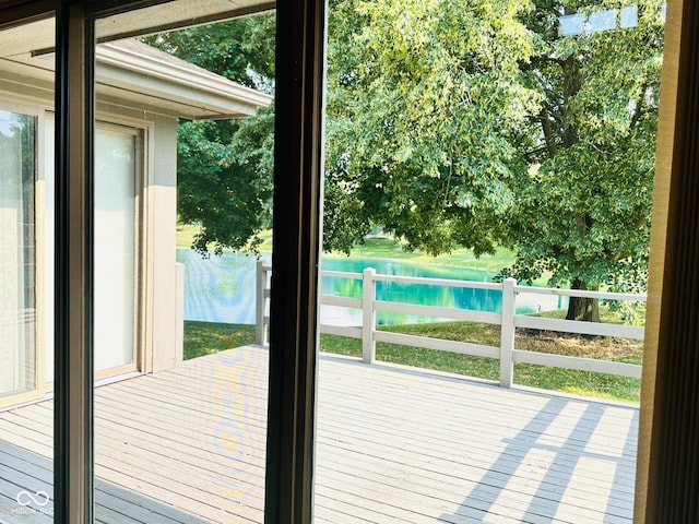 5720 Bayside Dr, Fort Wayne, IN 46815 - doorway to outside with a water view and view of wooded area