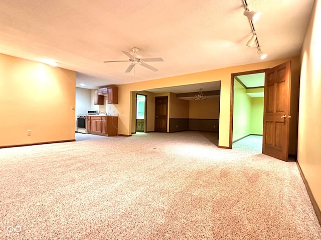5720 Bayside Dr, Fort Wayne, IN 46815 - unfurnished living room with carpet, rail lighting, and a ceiling fan