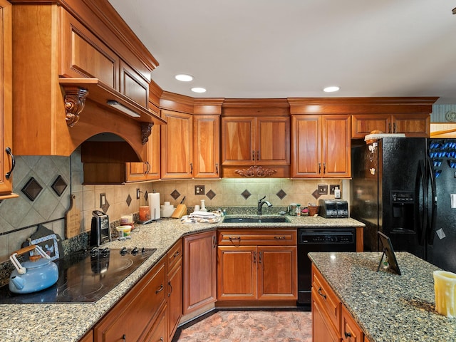2601 N Everett St, Crawfordsville, IN 47933 - kitchen featuring black appliances, light stone counters, brown cabinets, and backsplash