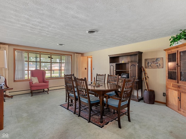 2601 N Everett St, Crawfordsville, IN 47933 - dining area featuring carpet floors, a textured ceiling, and a baseboard heating unit