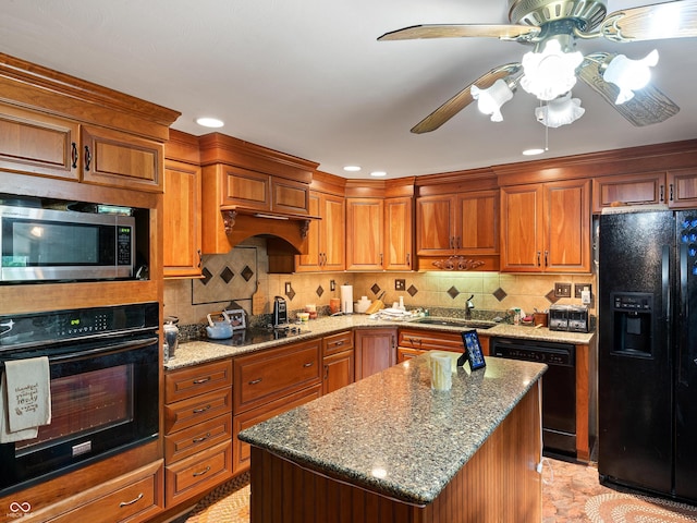 2601 N Everett St, Crawfordsville, IN 47933 - kitchen with black appliances, a ceiling fan, brown cabinets, stone counters, and backsplash