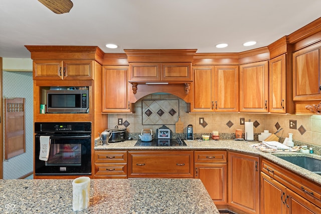 2601 N Everett St, Crawfordsville, IN 47933 - kitchen featuring black appliances and light stone counters