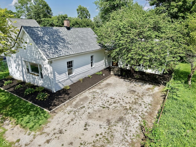 4833 Pennsylvania St, Clayton, IN 46118 - view of property exterior with a chimney and a shingled roof