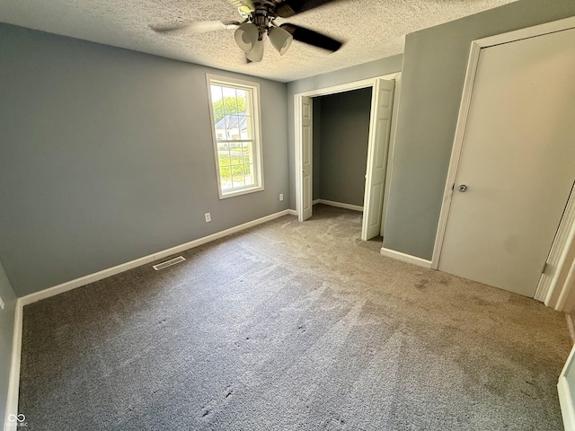 4833 Pennsylvania St, Clayton, IN 46118 - unfurnished bedroom with a textured ceiling, carpet flooring, a ceiling fan, and a closet
