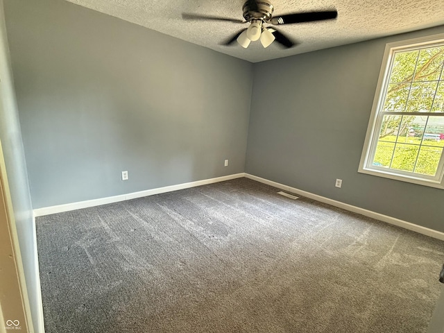 4833 Pennsylvania St, Clayton, IN 46118 - unfurnished room with a textured ceiling, a ceiling fan, and dark colored carpet