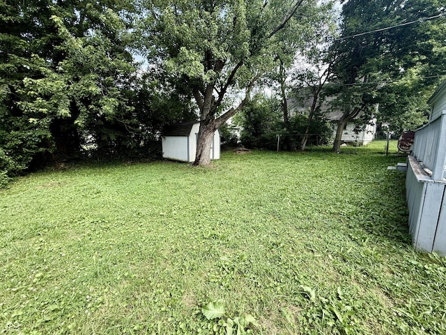 4833 Pennsylvania St, Clayton, IN 46118 - view of grassy yard featuring a storage unit