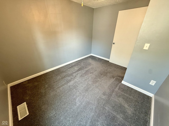 4833 Pennsylvania St, Clayton, IN 46118 - spare room with baseboards and dark carpet