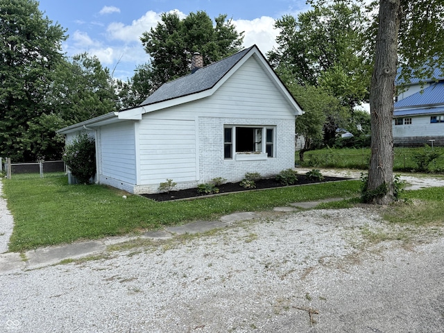 4833 Pennsylvania St, Clayton, IN 46118 - view of home's exterior featuring a chimney and brick siding