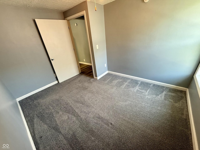 4833 Pennsylvania St, Clayton, IN 46118 - unfurnished bedroom with carpet flooring and a textured ceiling