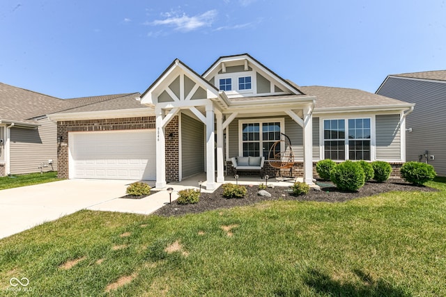 9846 Zion Way, Pendleton, IN 46064 - view of front facade with brick siding, a porch, a garage, and a front lawn