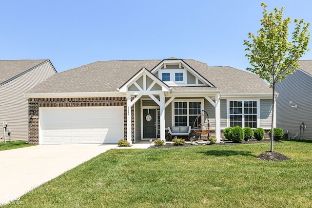 9846 Zion Way, Pendleton, IN 46064 - view of front of property with a front lawn, a garage, driveway, a shingled roof, and a porch