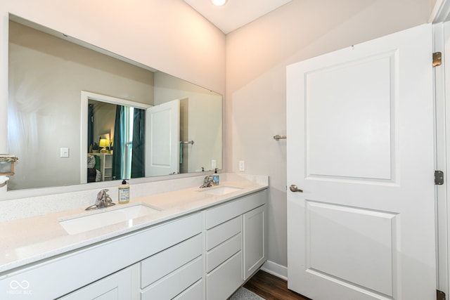 9846 Zion Way, Pendleton, IN 46064 - bathroom featuring double vanity and wood finished floors